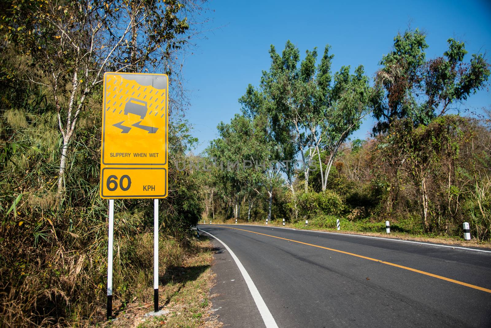 Signs on the way in the yellow, beware of rain