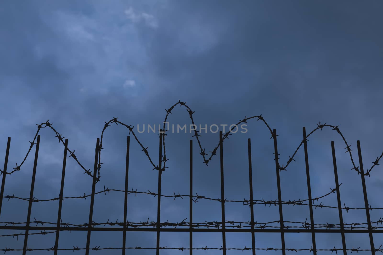 barbed wire fence at night