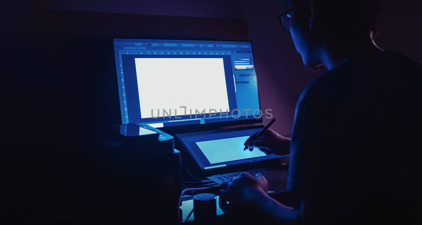 freelance designer working at night by winnond