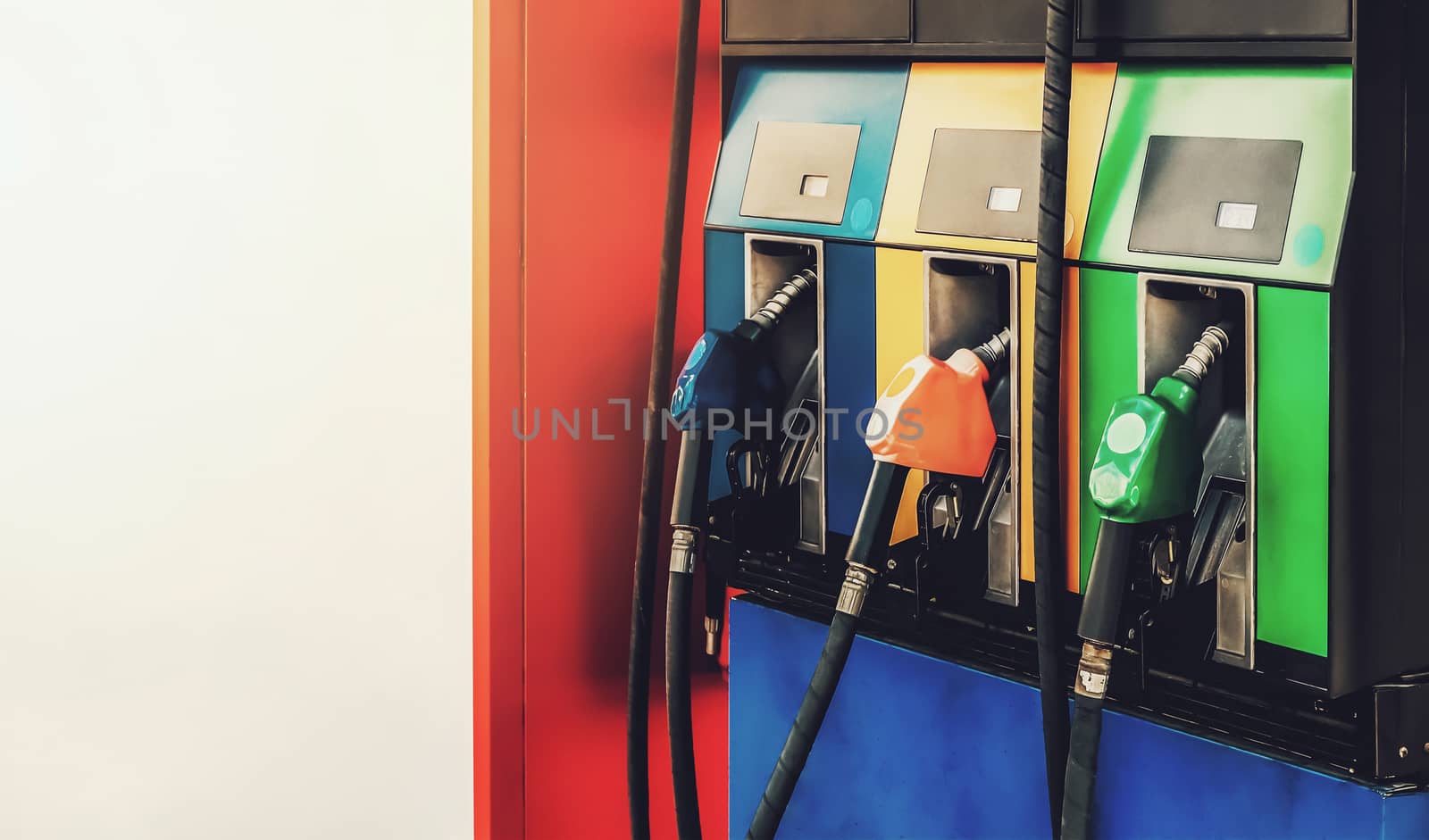 fuel nozzles at gas station by winnond