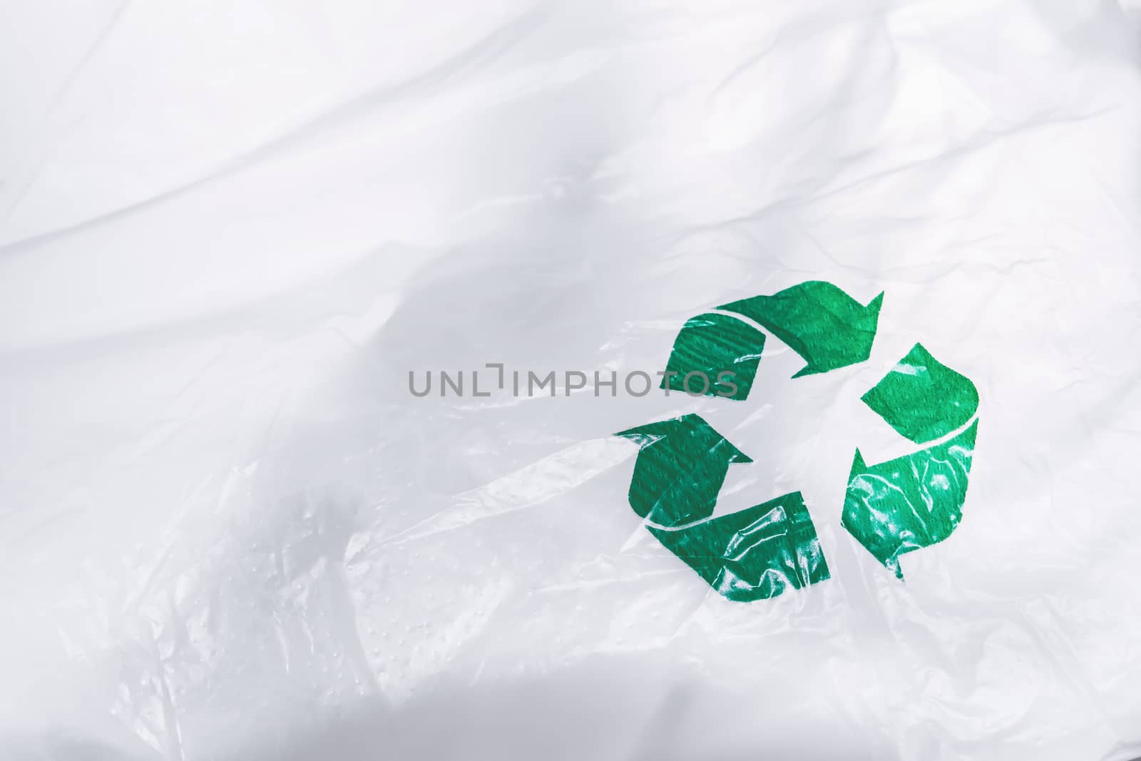 recycle sign on white plastic by winnond