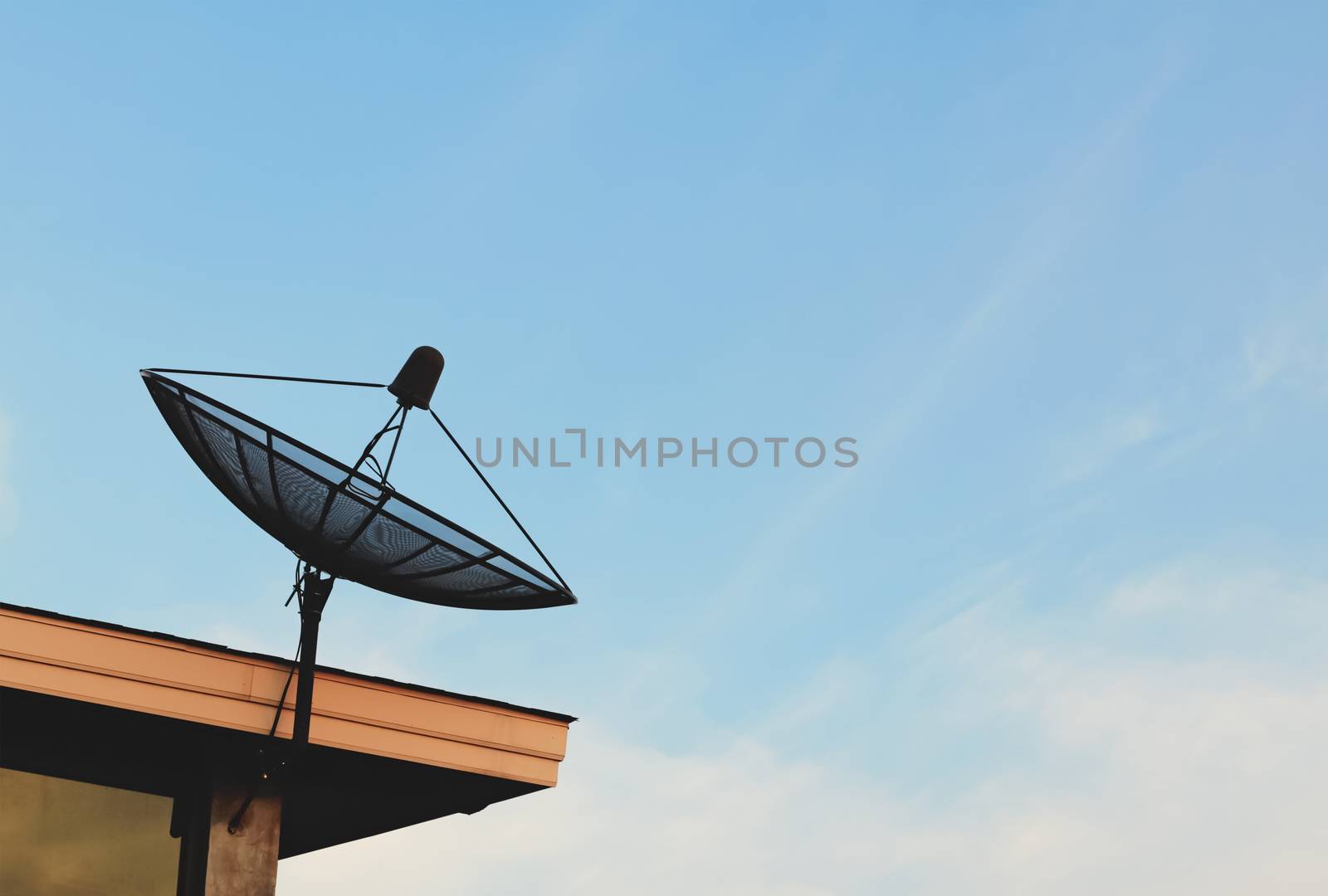 satellite dish on the roof and blue sky background