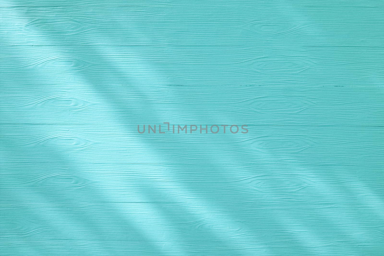 sunlight on the blue turquoise wooden board background