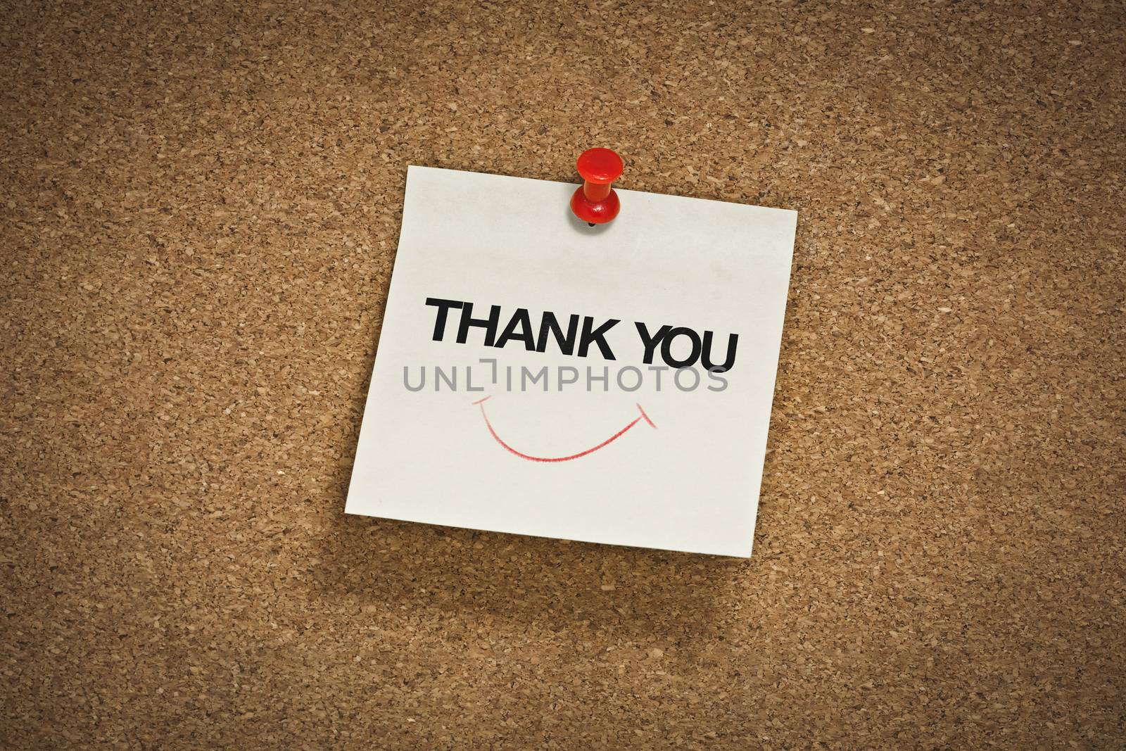thank you word with smile symbol on notepad