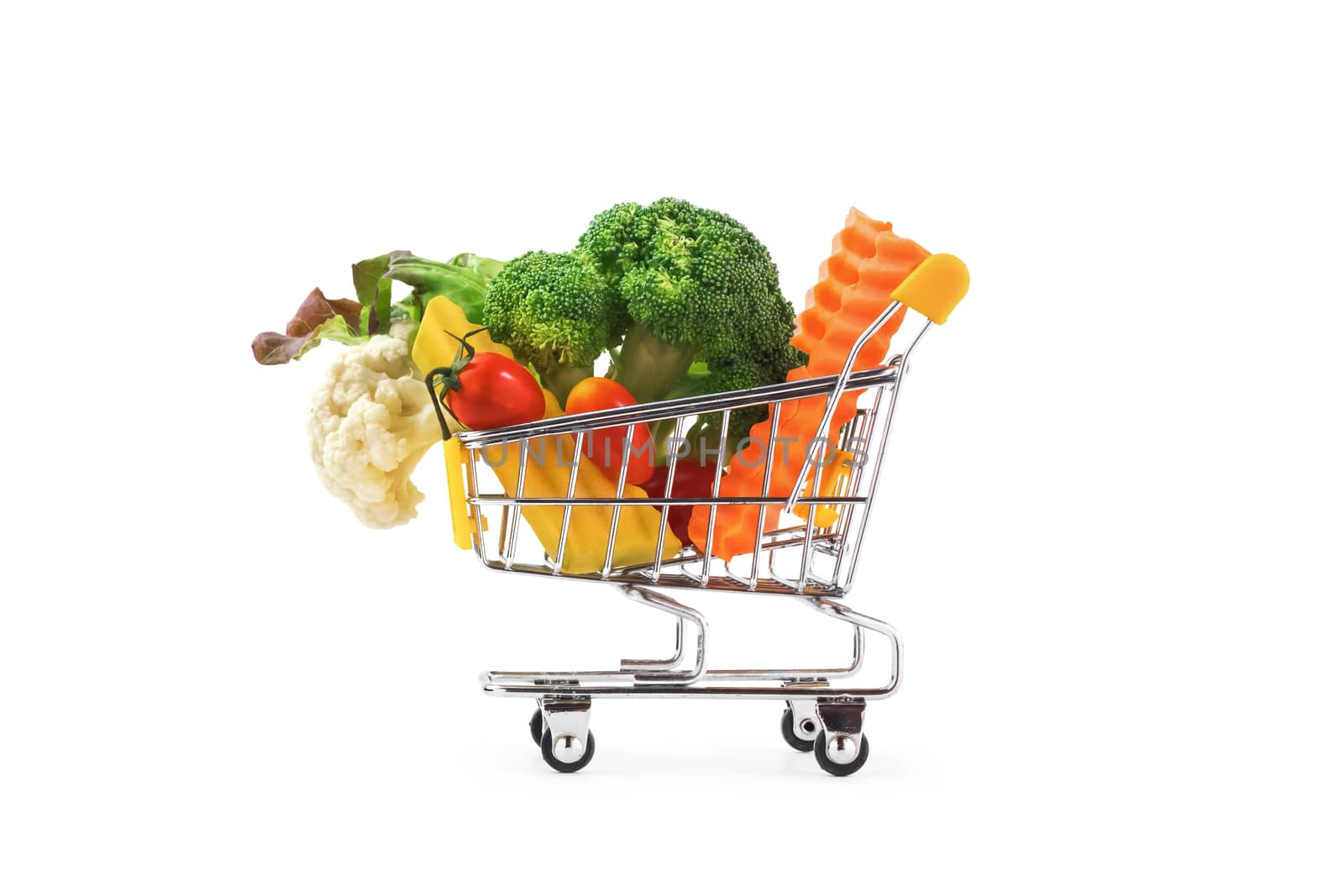 colorful vegetables in the cart isolated on white background
