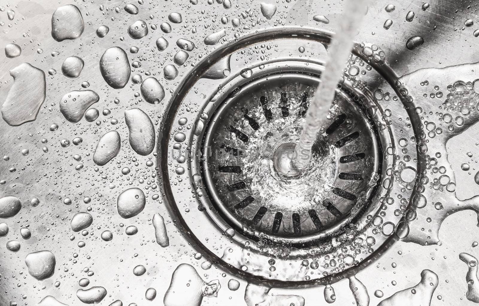 water down on stainless kitchen sink