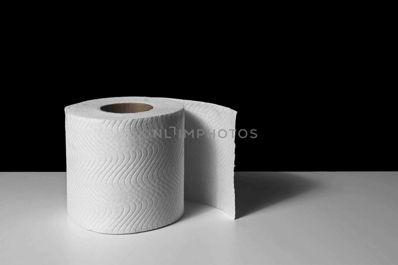 roll of toilet tissue paper on white table
