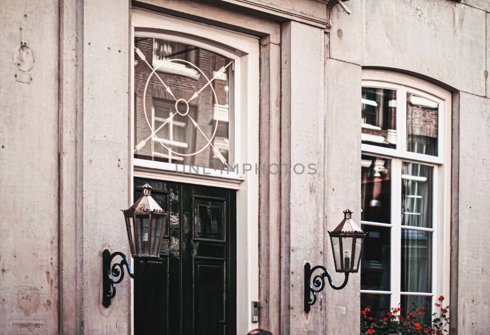 Architectural detail of a building on the main city center street of Amsterdam in Netherlands by Anneleven