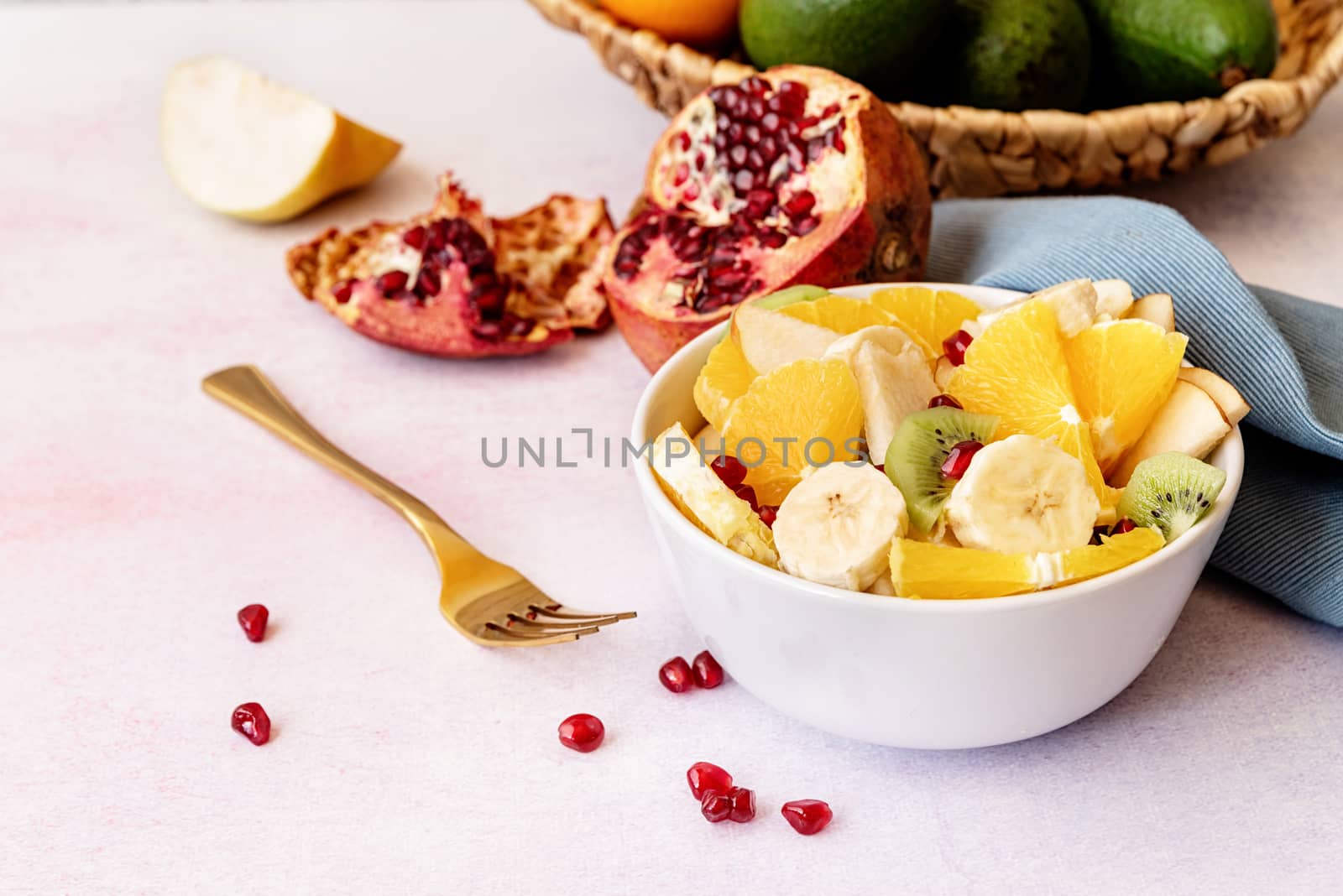 Healthy dieting. Close up of fresh fruit salad on white marble background