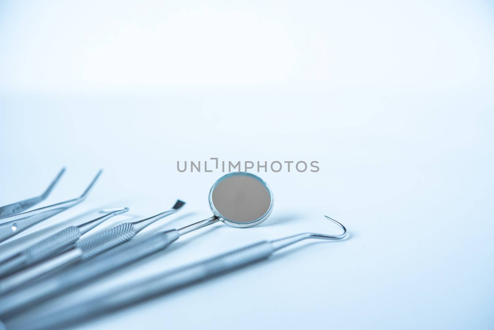  close up dentist  tools for teeth care at white background top view 