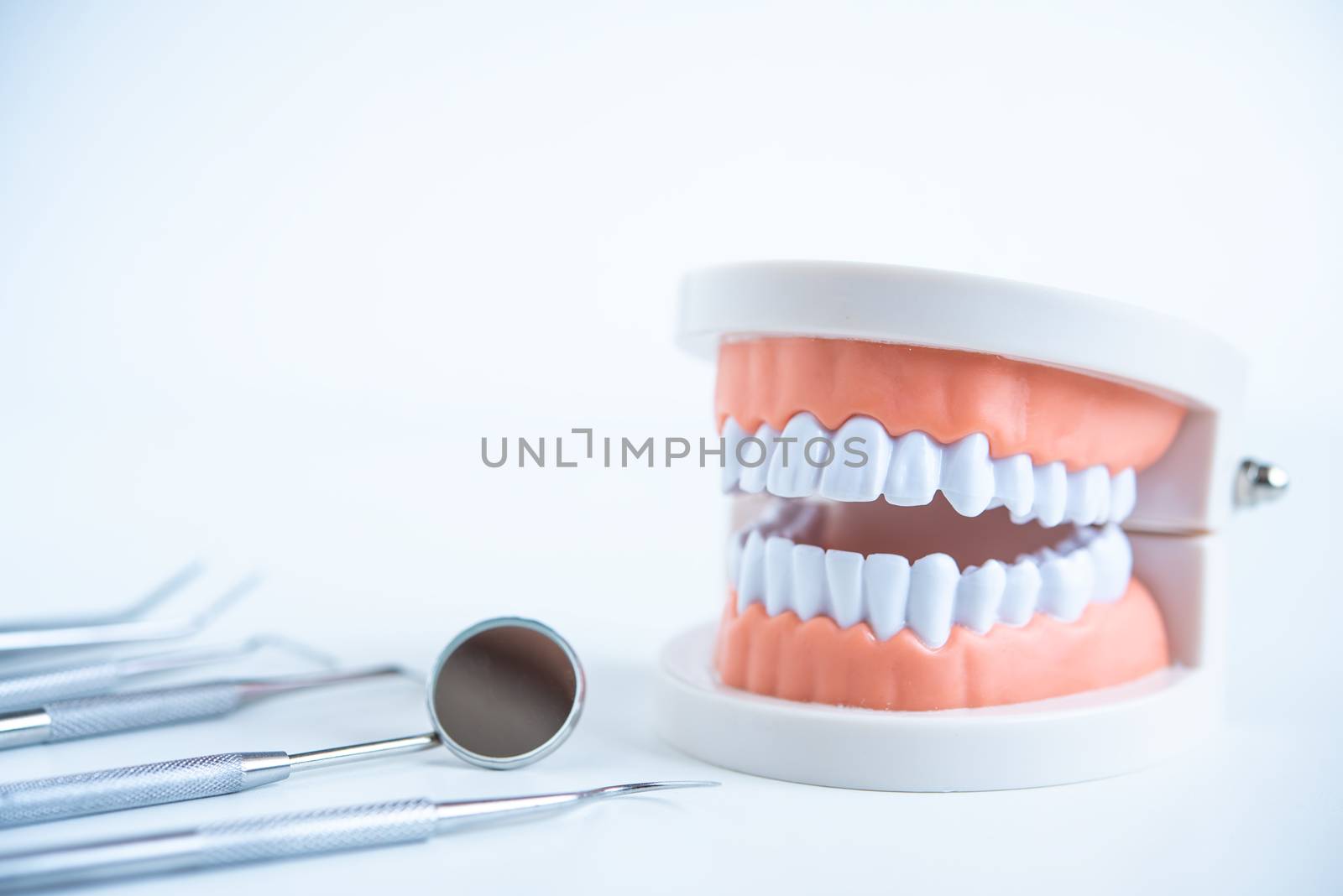  close up dentist  tools for teeth care at white background top view 