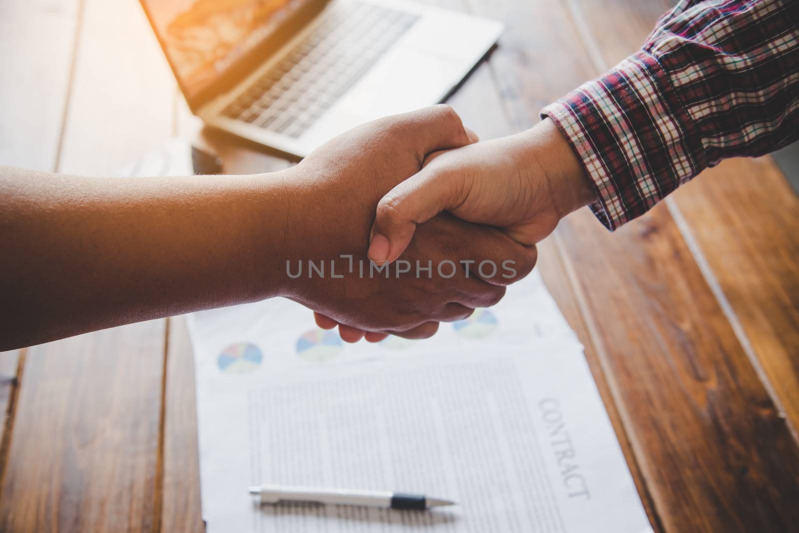 Businessmen meeting and cooperating handshaking in contracts