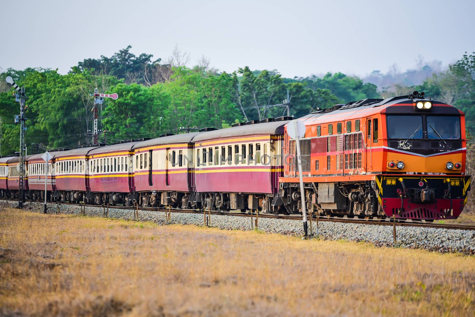 Old Thai-style trains that can still pick-up passengers on the train tracks