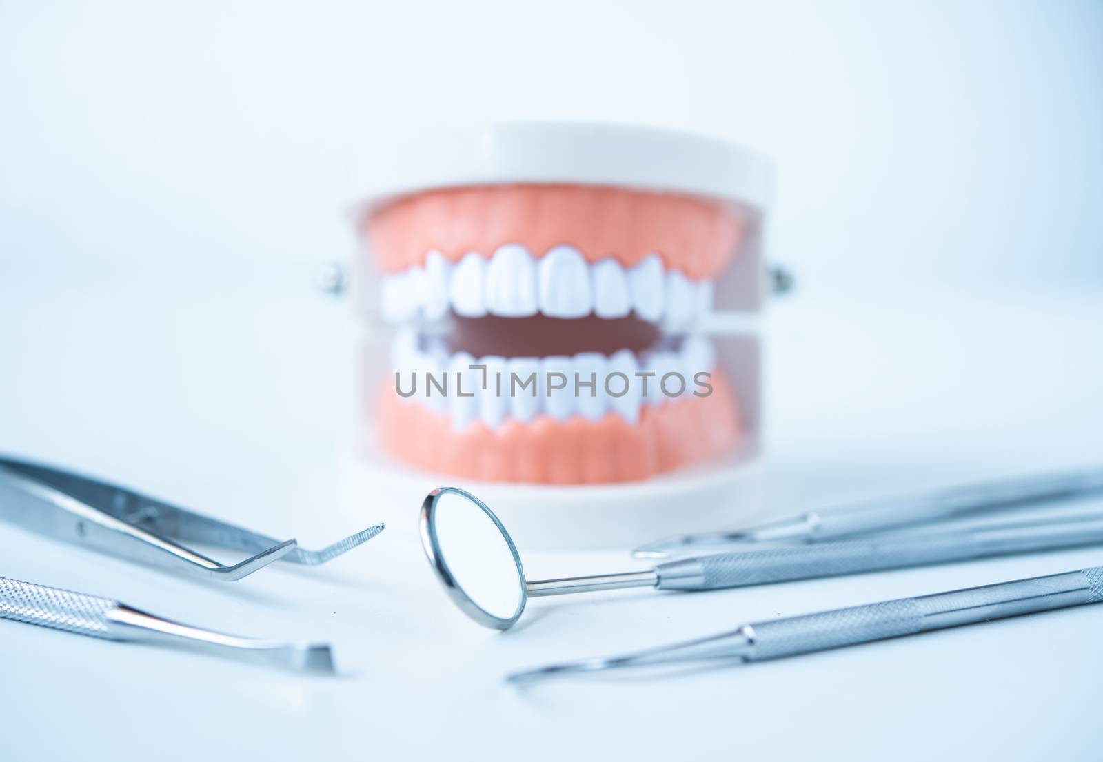  close up dentist  tools for teeth care at white background top  by photobyphotoboy