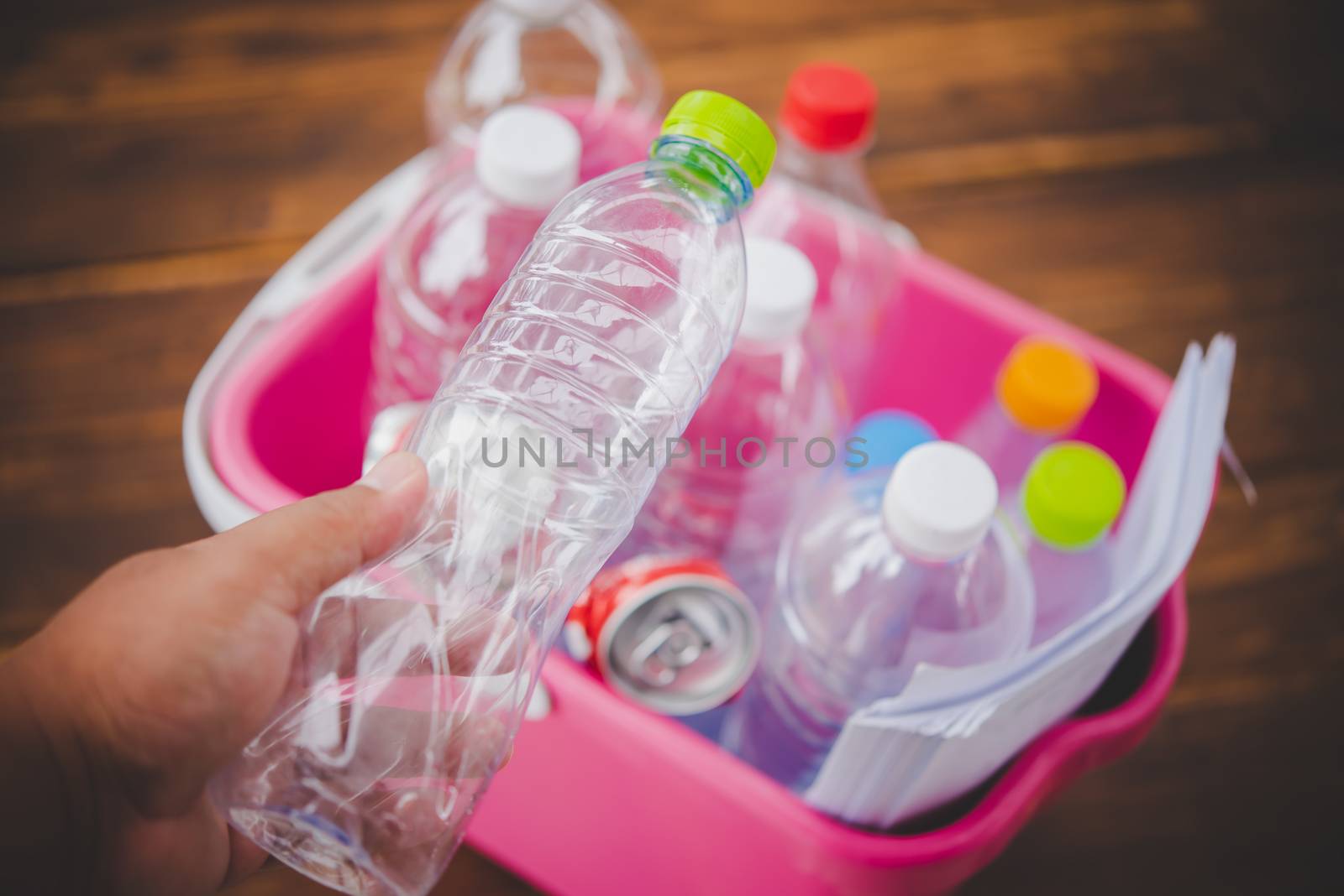 Hands holding bottles for recycling, green concept by photobyphotoboy