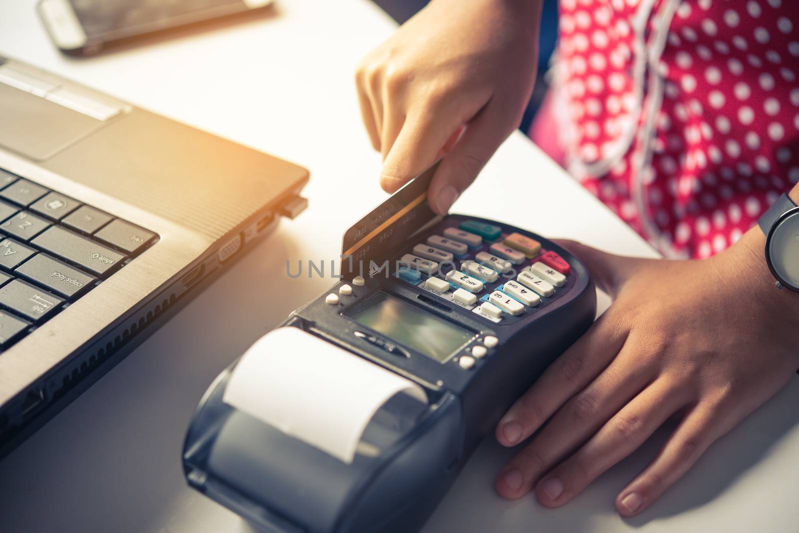 Paying by credit card , buying and selling products using a credit card swipe machine