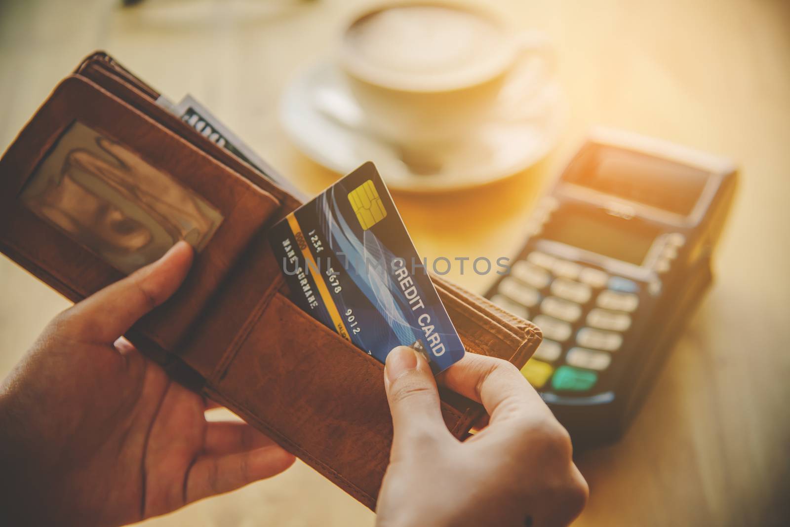 Close up of hand hold credit card to pay. Online payment . Paying by credit card