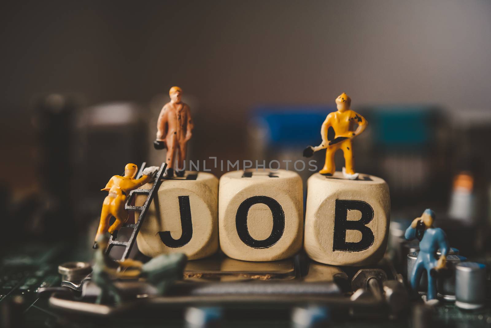 Miniature people or small figure worker on wood block with the w by photobyphotoboy