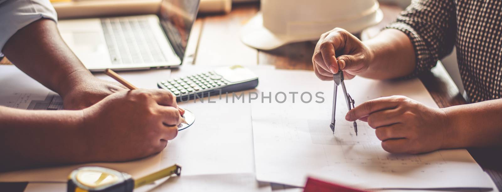 Team of engineers working together in a architect office. by photobyphotoboy