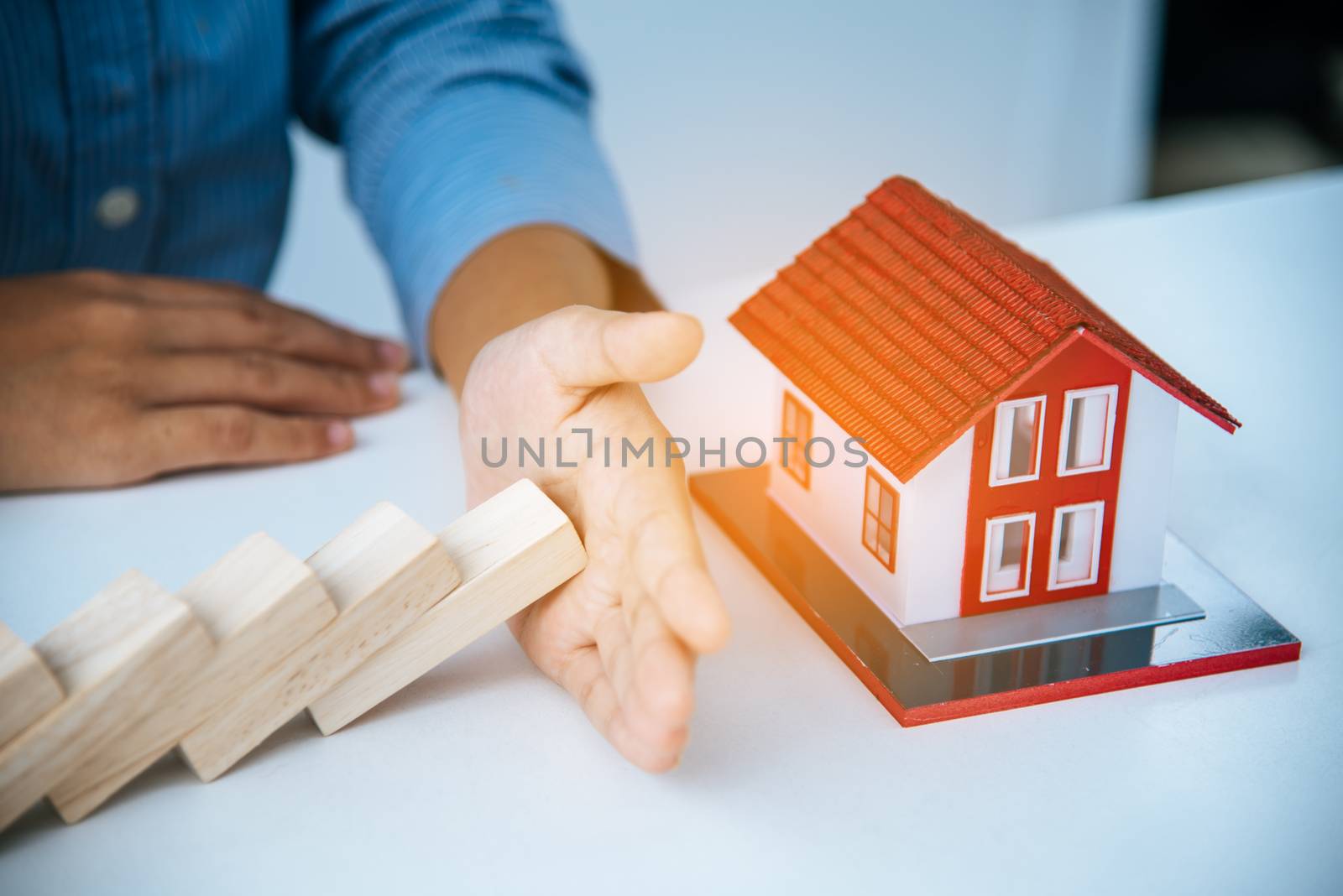  hand stopping risk the wooden blocks from falling on house, Hom by photobyphotoboy