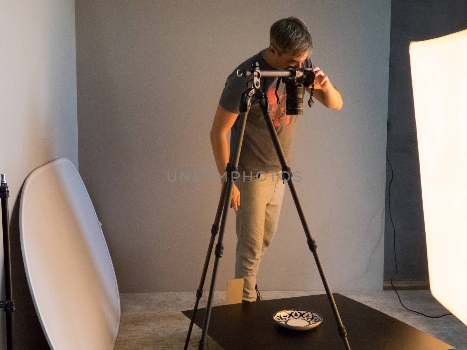 the photographer fills the order in the studio. unintended photography
