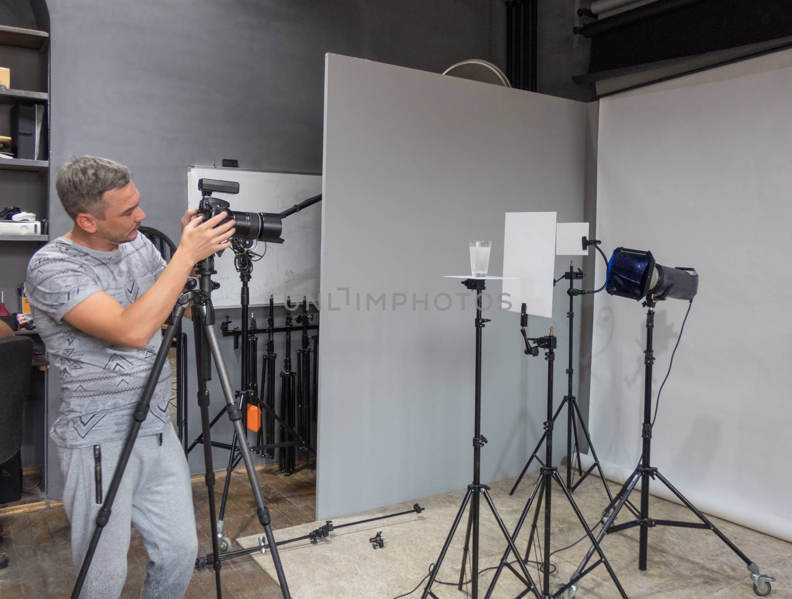 the photographer in the photo studio performs the order for shooting. unintended photography