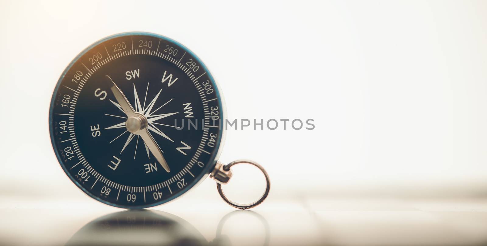 The blue compass is placed on background. by photobyphotoboy