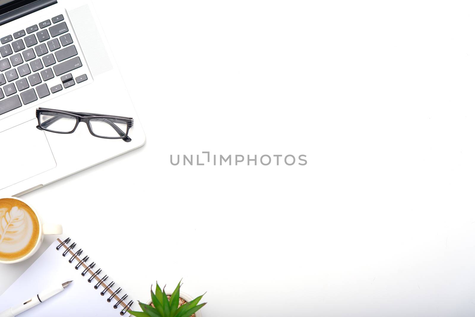 Top view with working desk with laptop,cellphone,notebook pencil by photobyphotoboy