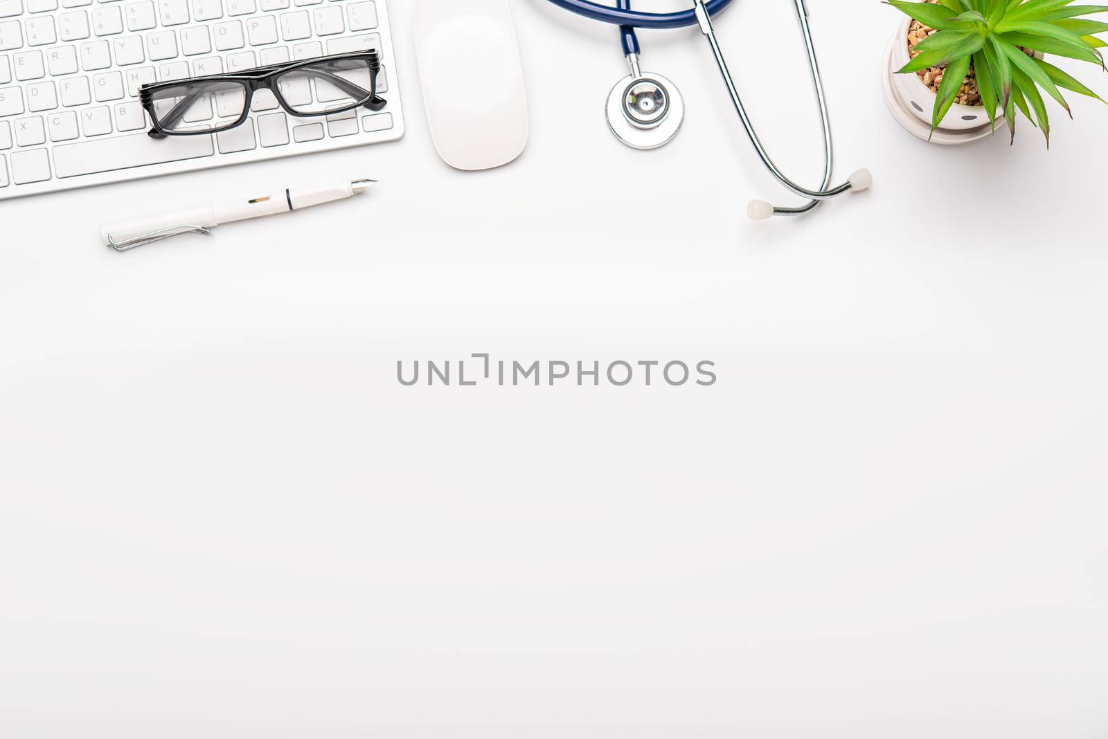 Top view with working desk with laptop,cellphone,notebook pencil coffee cup and eyeglasses in the office. 