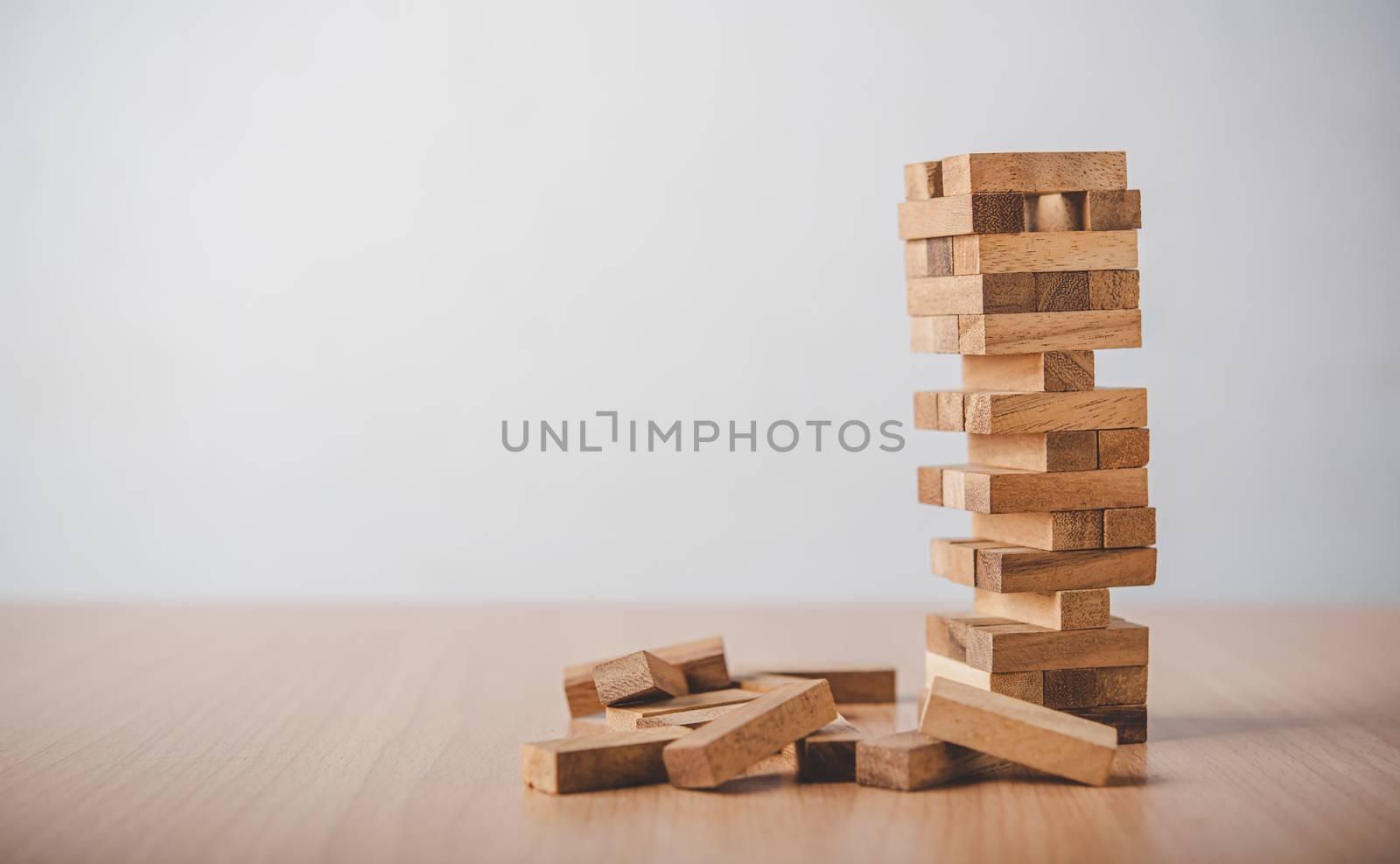 game drew to a wooden block from the tower.concept  business risks in the business. Requires planning meditation must be careful in deciding to reduce the risk in the business. 
