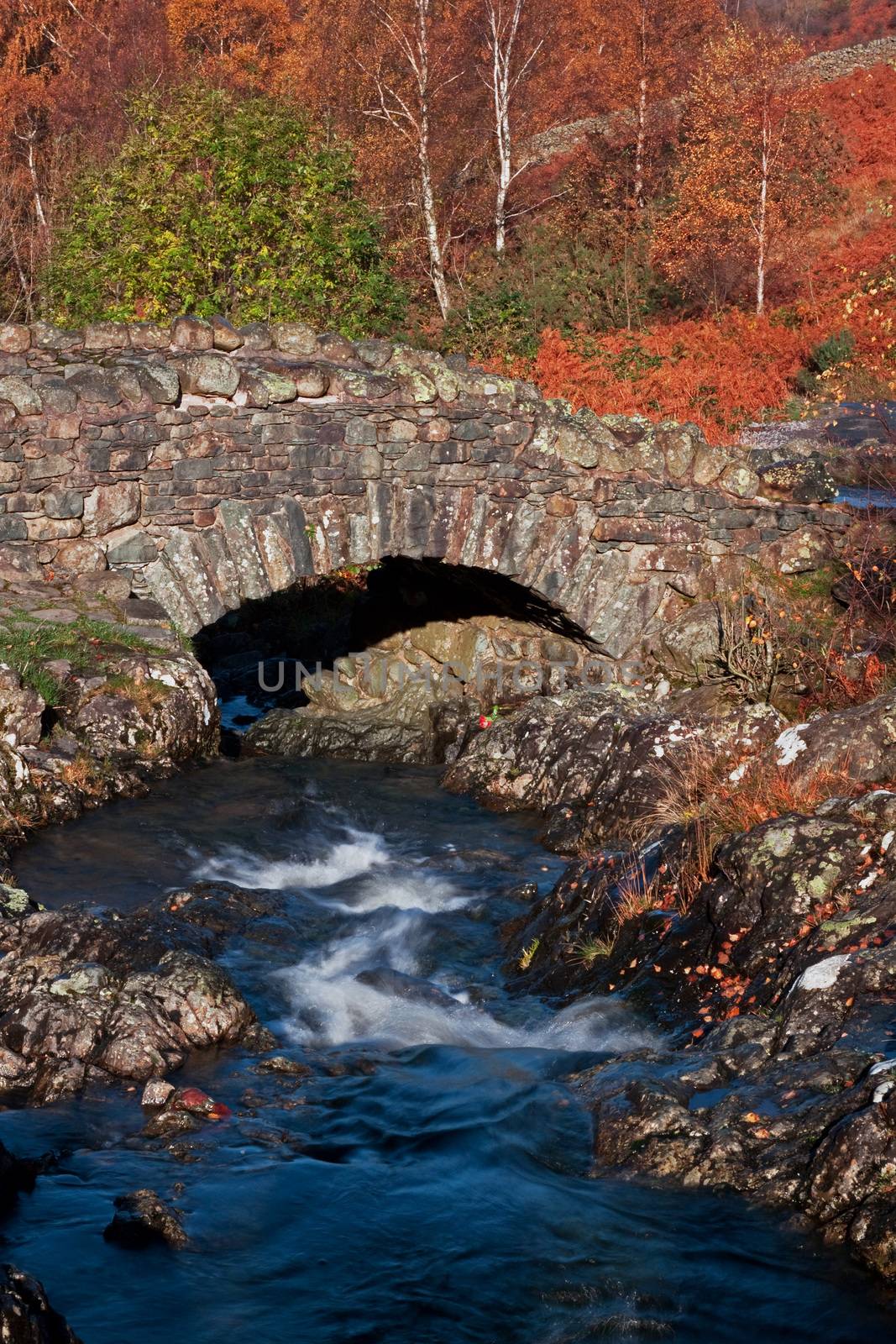 Ashness Bridge is a picturesque humped back bridge crosses Barrow Beck and is a landmark close to Derwentwater in the English Lake District national park.