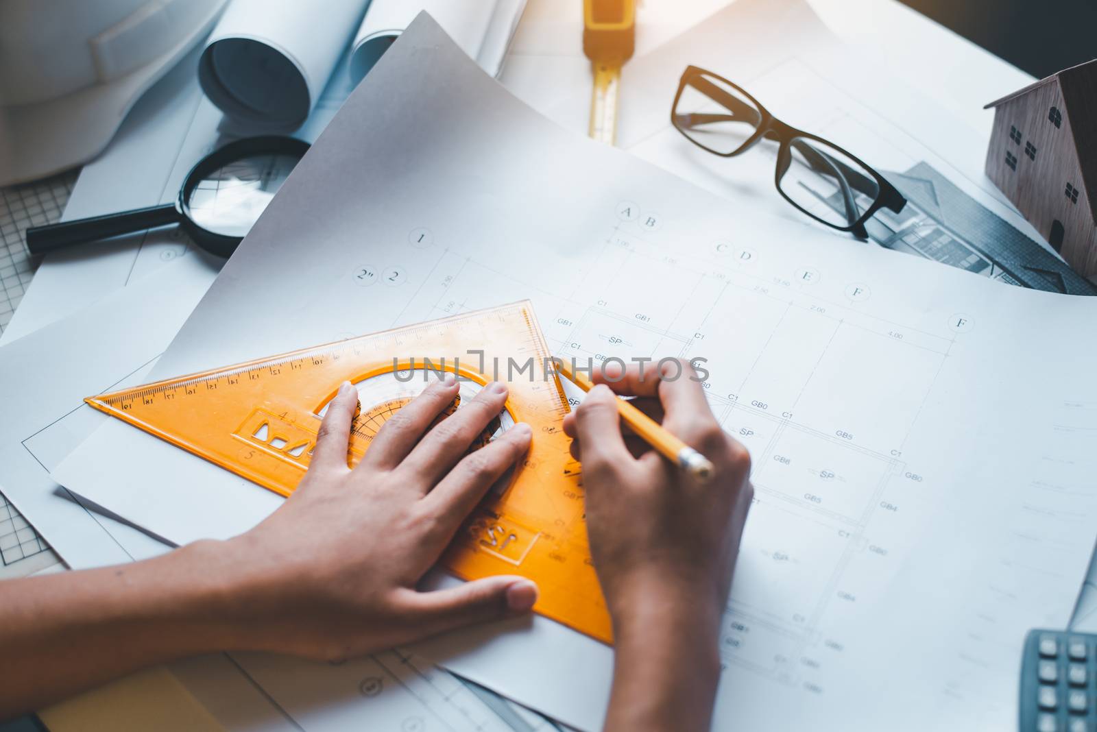  engineer working in office with blueprints, inspection in workp by photobyphotoboy