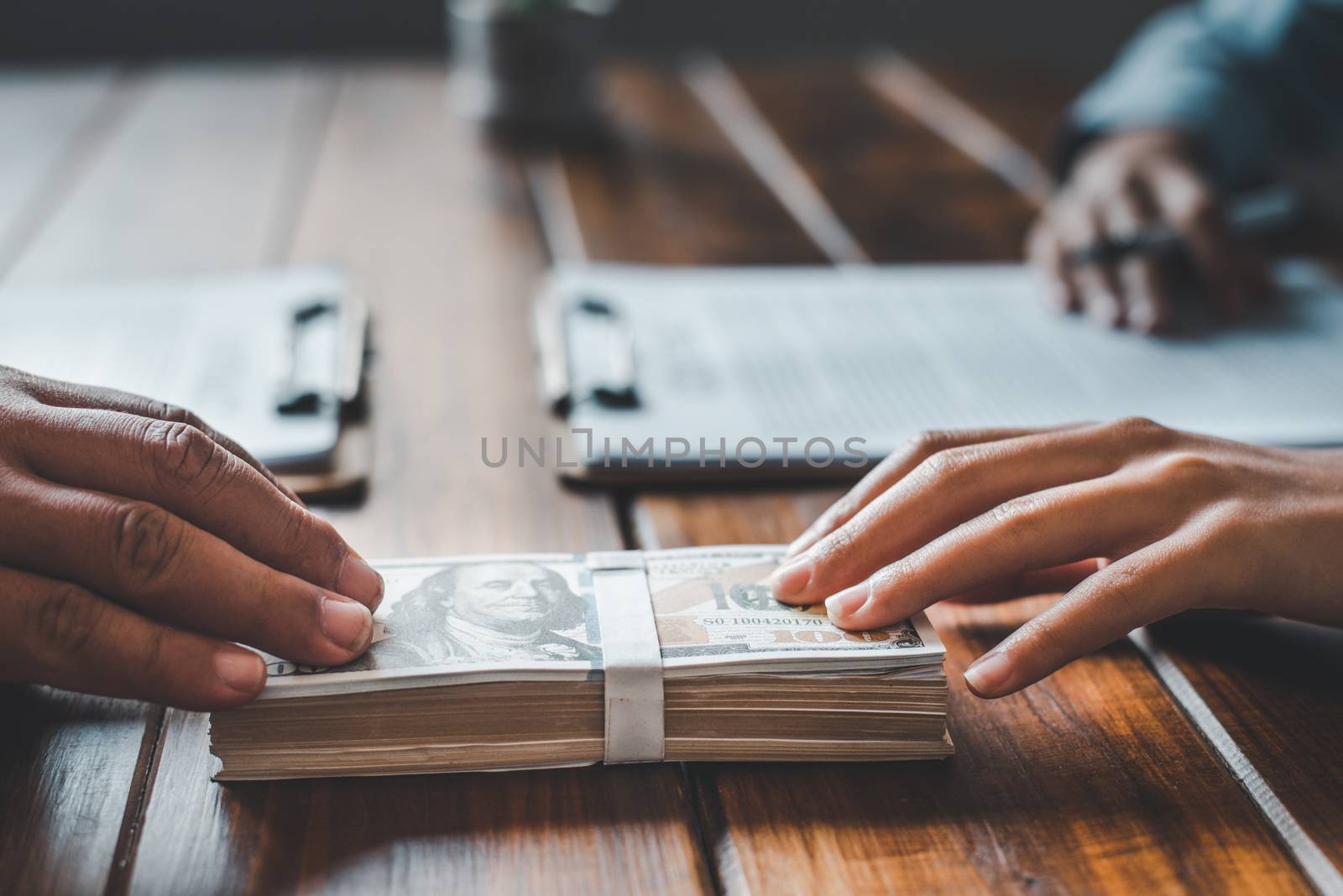 Businessmen accepting bribes for signing contracts. The concept  by photobyphotoboy