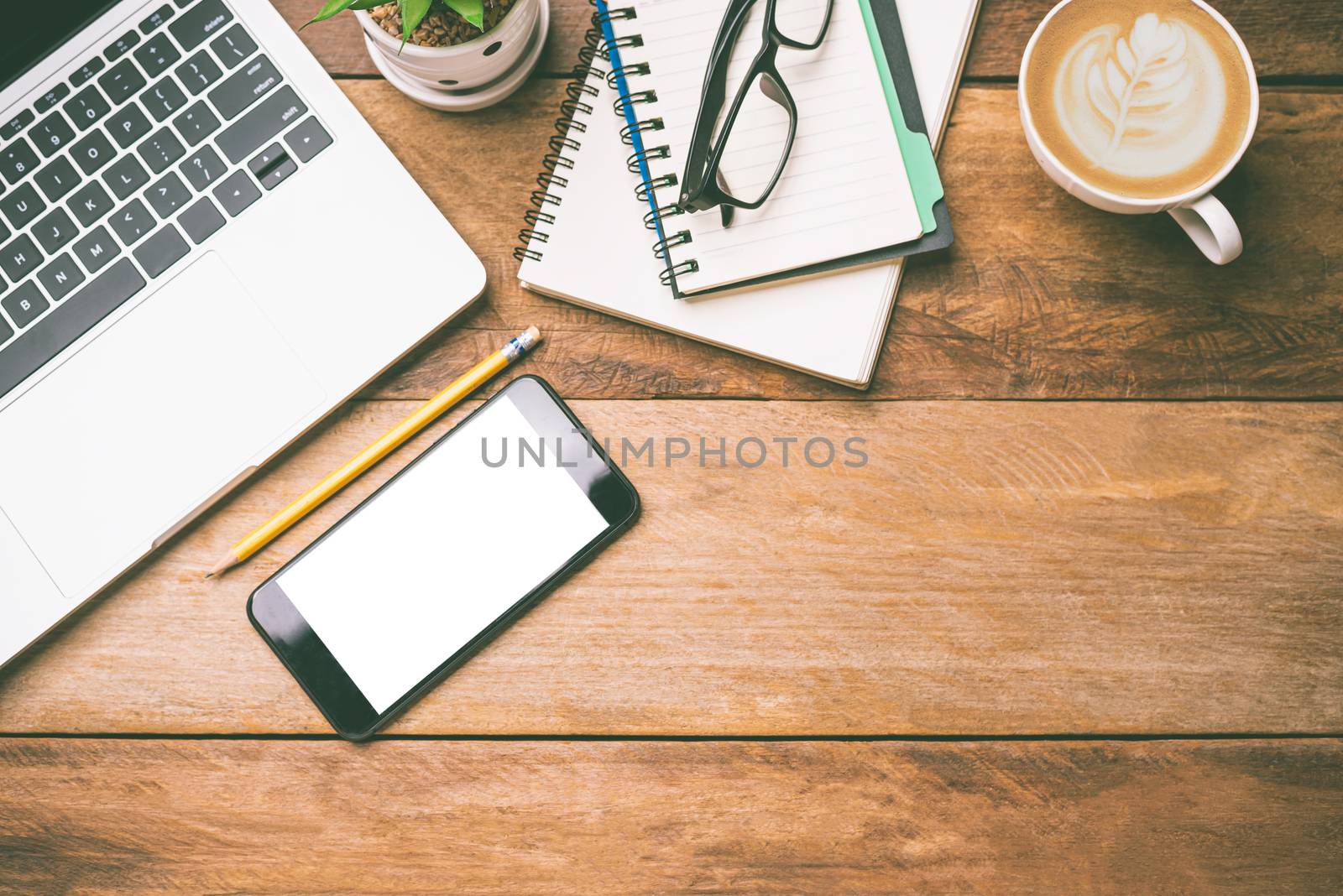 top view Office equipment including Laptop, mobile phone, mouse, by photobyphotoboy