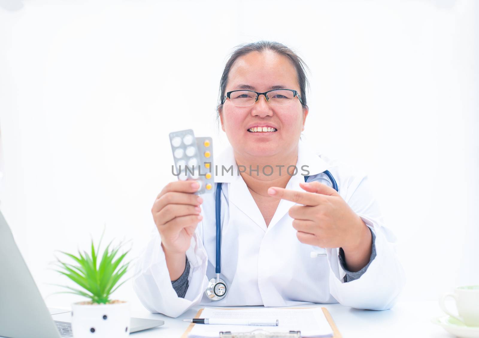 Portrait of a female doctor on a white background giving knowledge about drug use