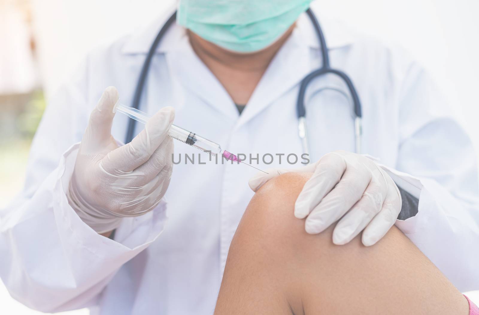 The doctor provided treatment for knee pain by injection. by photobyphotoboy