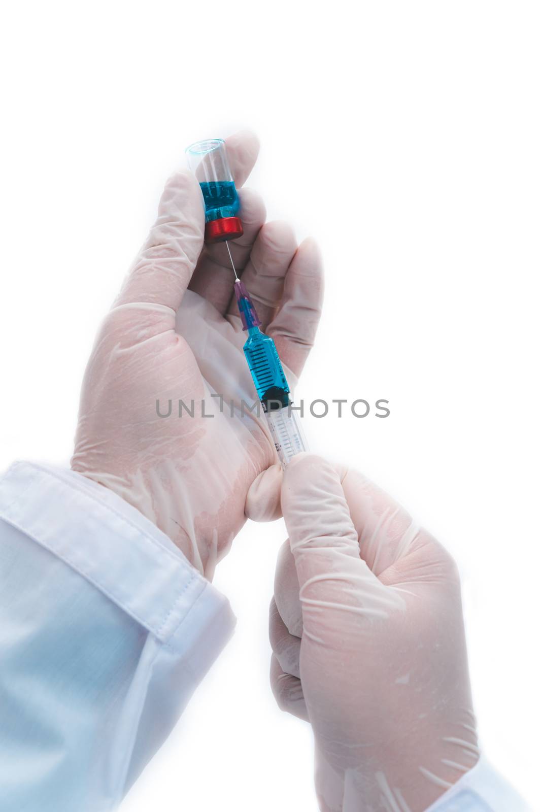 close-up doctor with syringe ready for injection of vaccine to p by photobyphotoboy