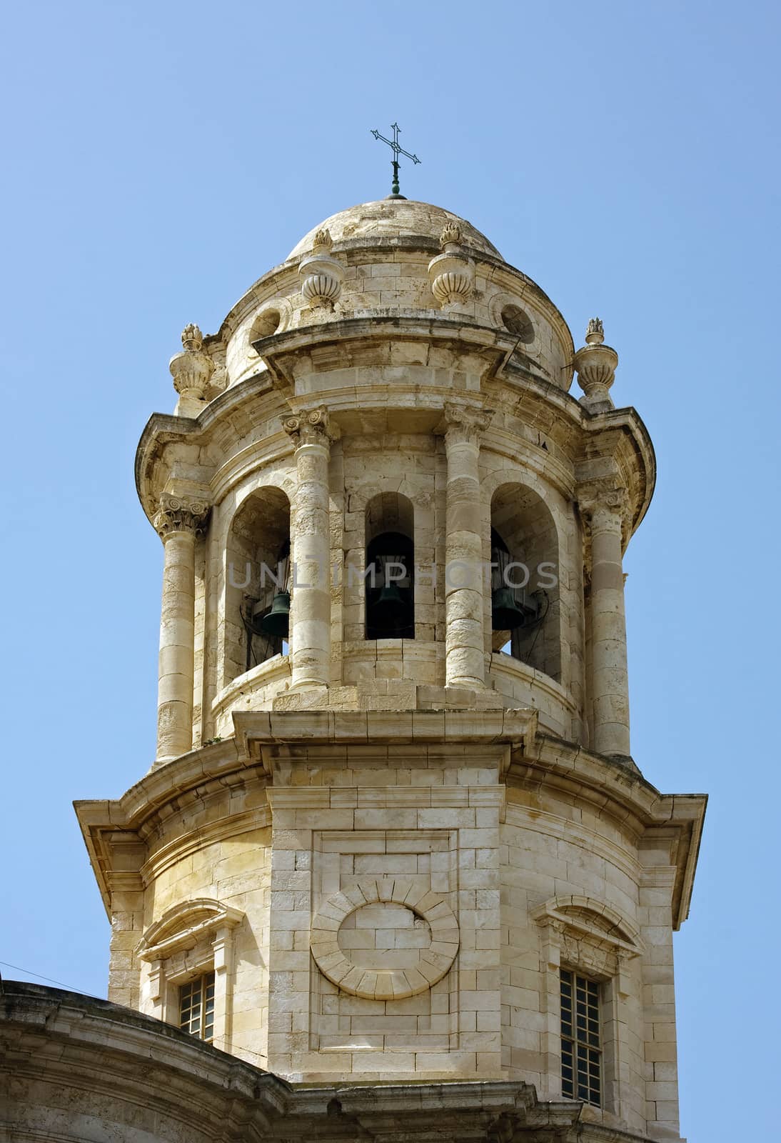 The Poniente or West Tower is one of two bell towers of Cadiz Cathedral as viewed from cathedral square in Cadiz, Spain.