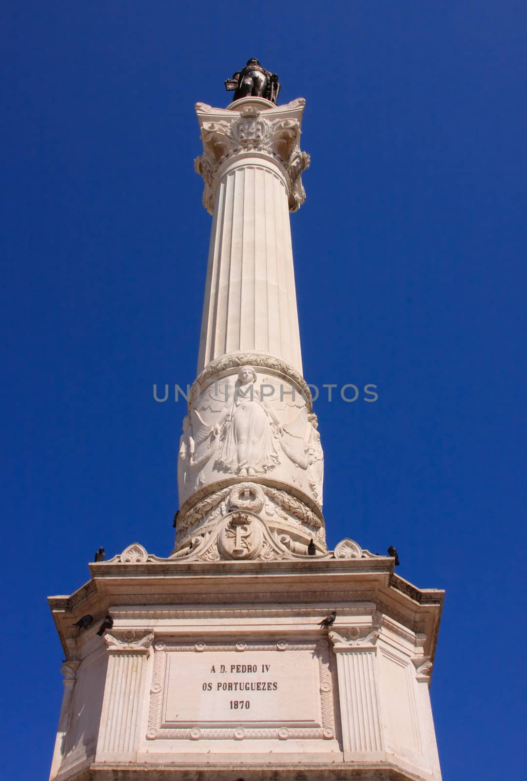 The monument to king Dom Pedro IV is situated in Rossio Square in Lisbon, Portugal.