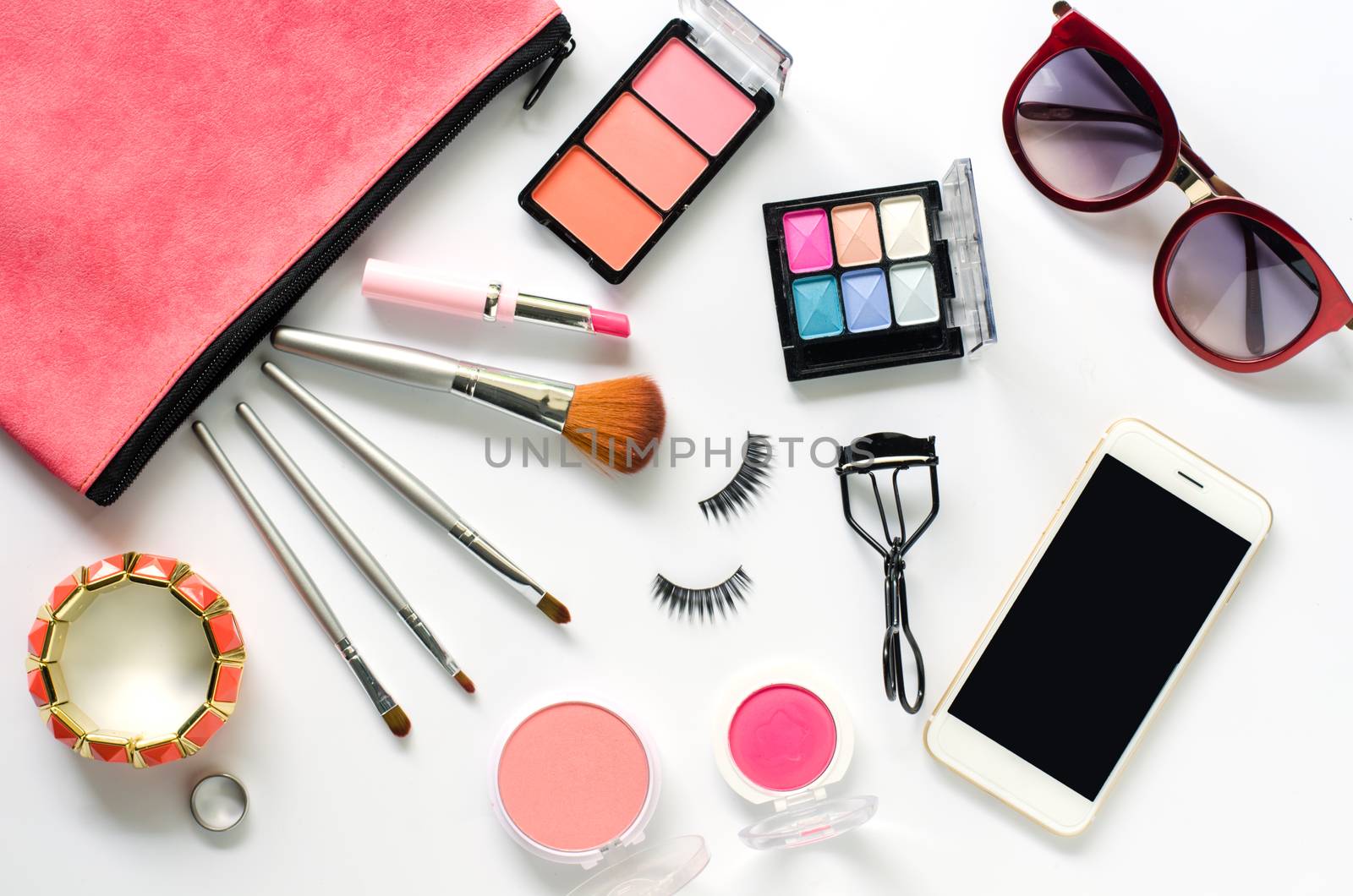 Set of decorative cosmetics and accessories for women on white background