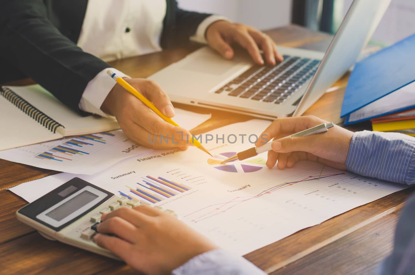 Business team working with laptop in open space office. Meeting  by photobyphotoboy