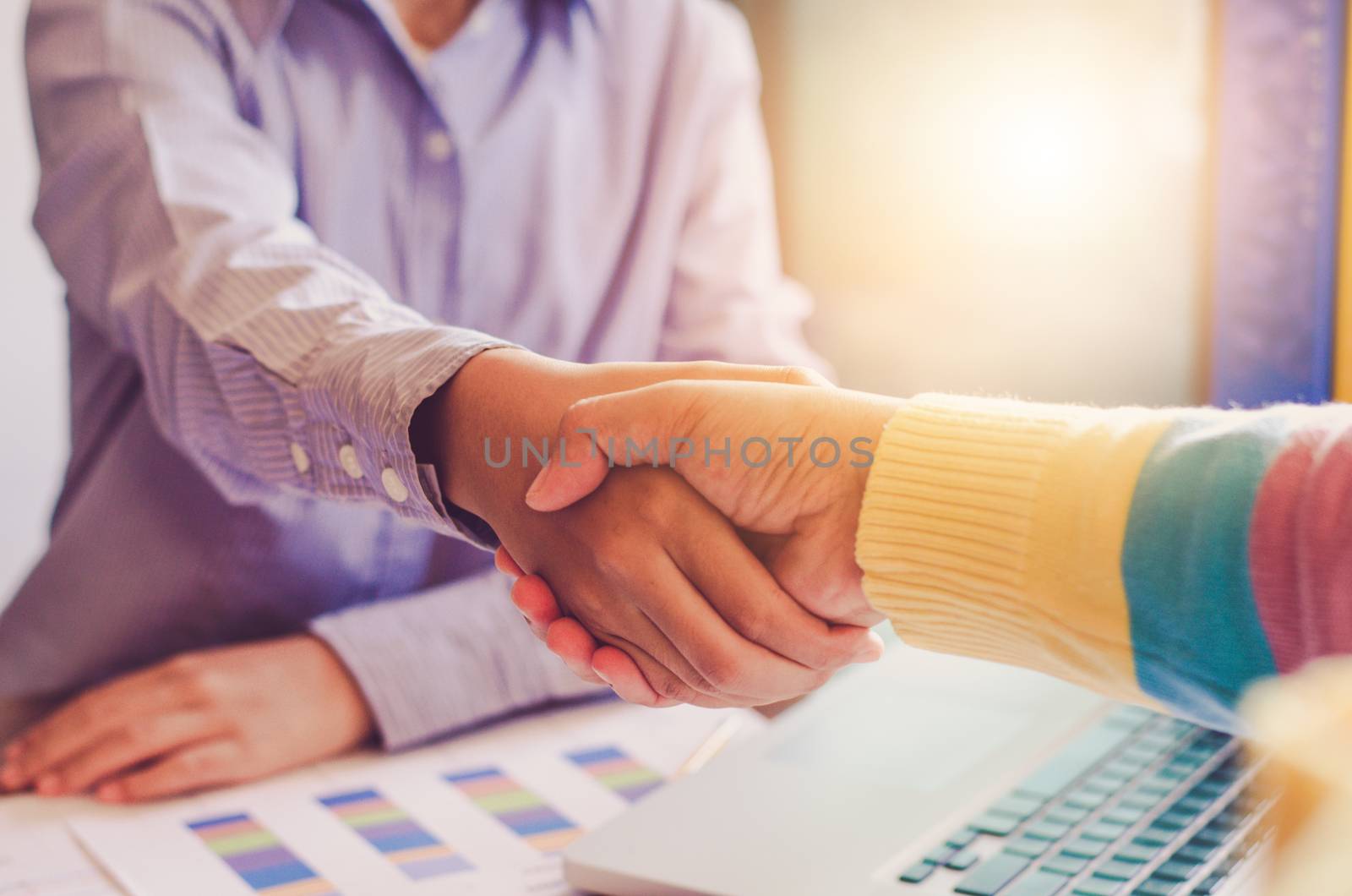 Handshake between joint venture businessmen after good management and have good concept 