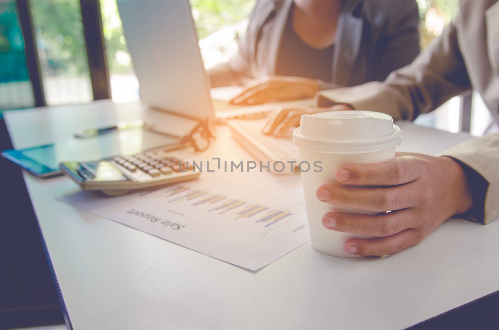 Business team working with laptop in open space office. Meeting  by photobyphotoboy