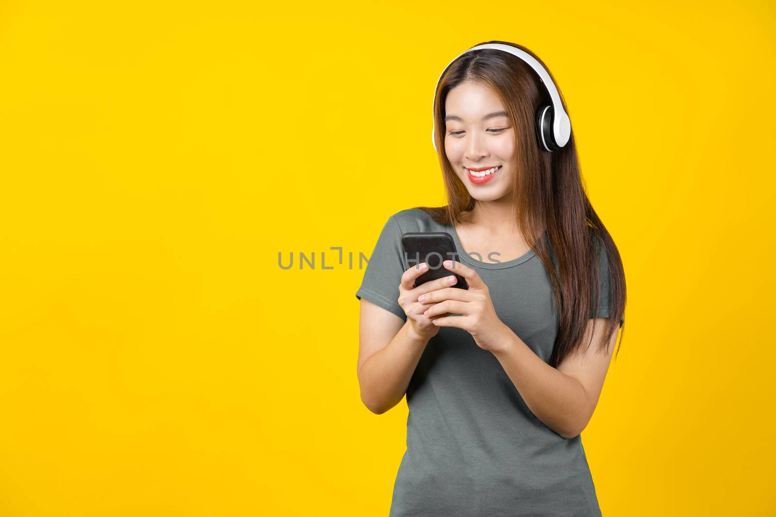 Happiness Asian smiling young woman wearing technology wireless  by Tzido