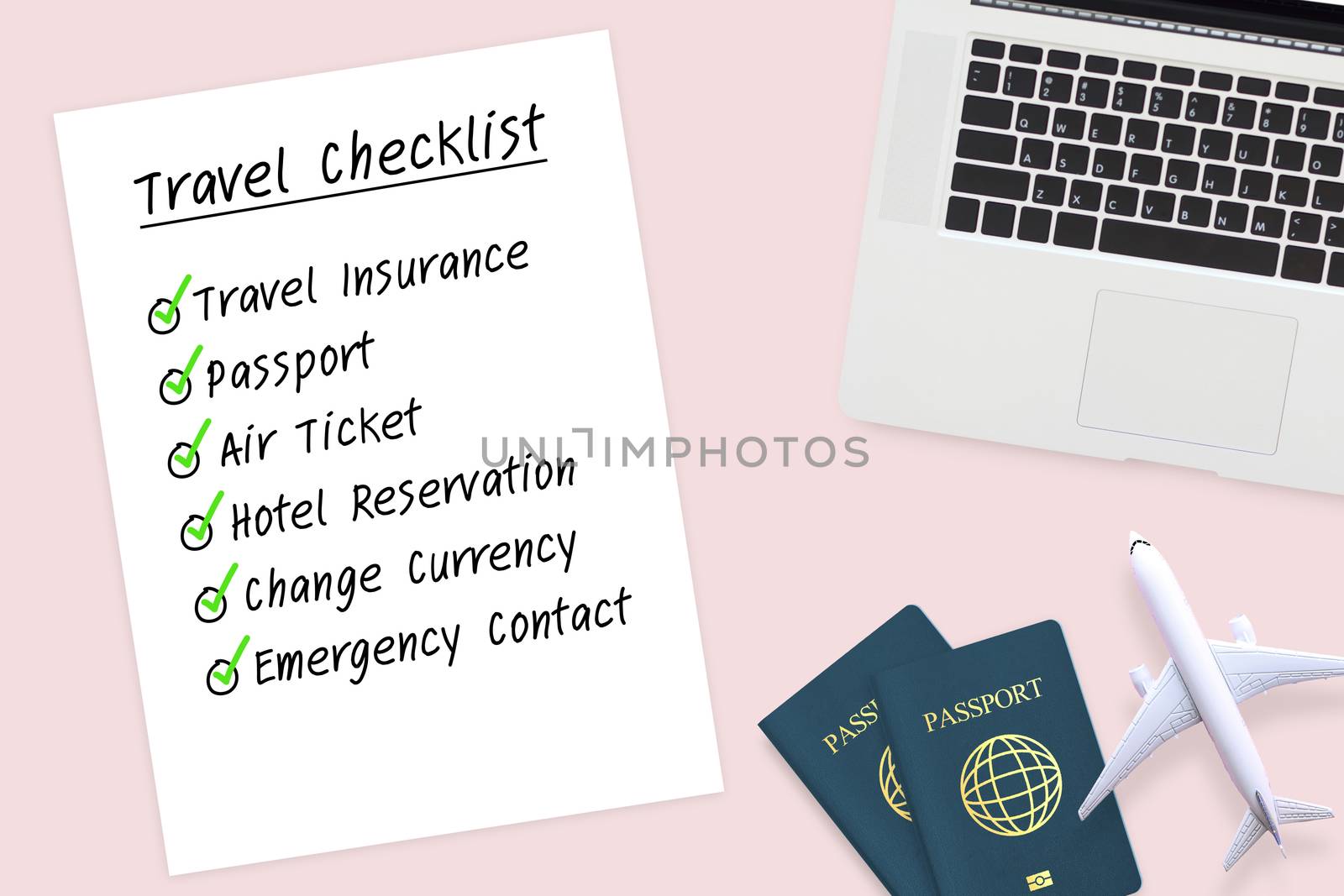 travel checklist paper to prepare before travel with passport , plane model and computer laptop on pastel pink color background. travel checklist concept