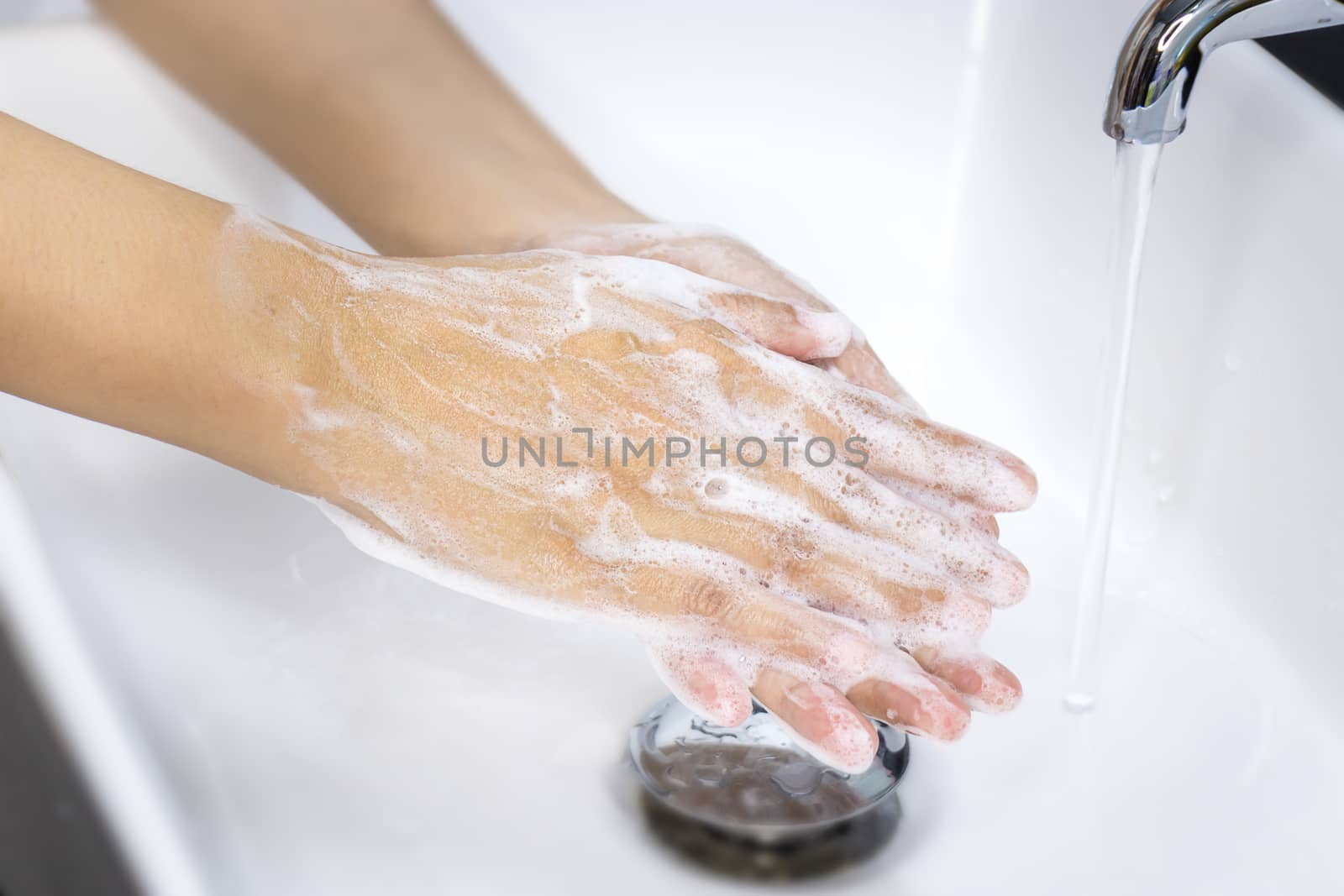 hygiene concept. washing hands with soap in sinks, keep clean to protect from virus and bacteria disease
