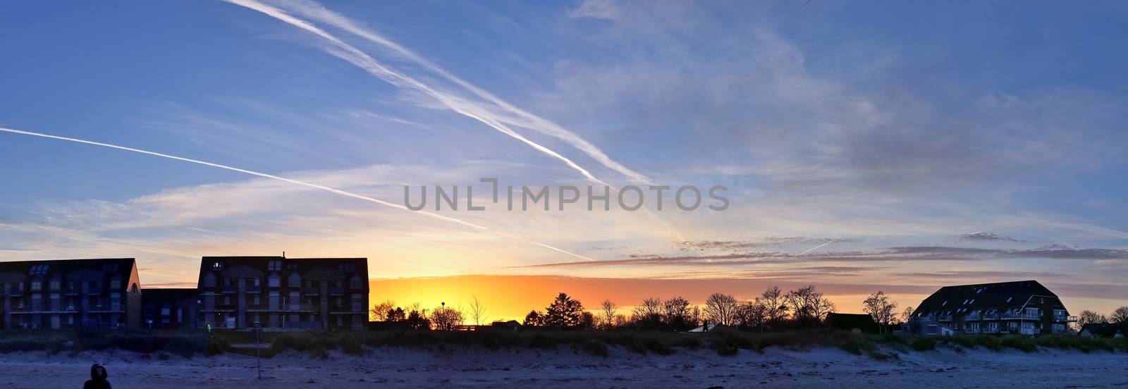 Beautiful high resolution panorama of a northern european country landscape with fields and green grass.