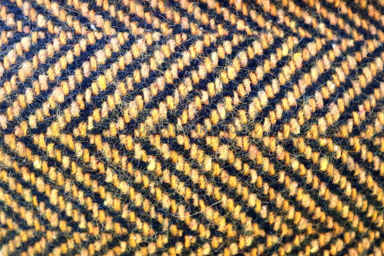 Detailed close up view on samples of cloth and fabrics in different colors found at a fabrics market.