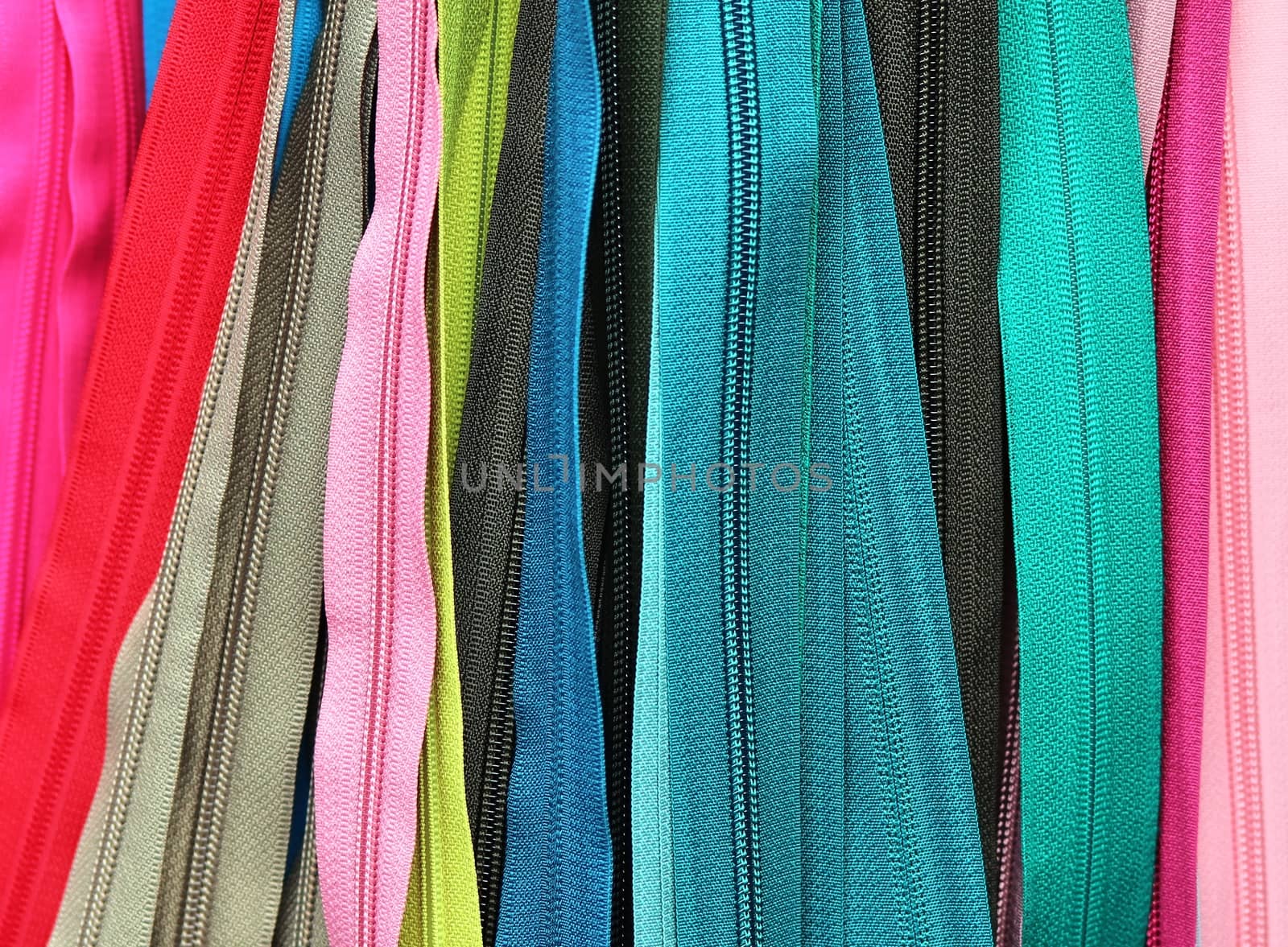 Detailed close up view on samples of cloth and fabrics in different colors found at a fabrics market.