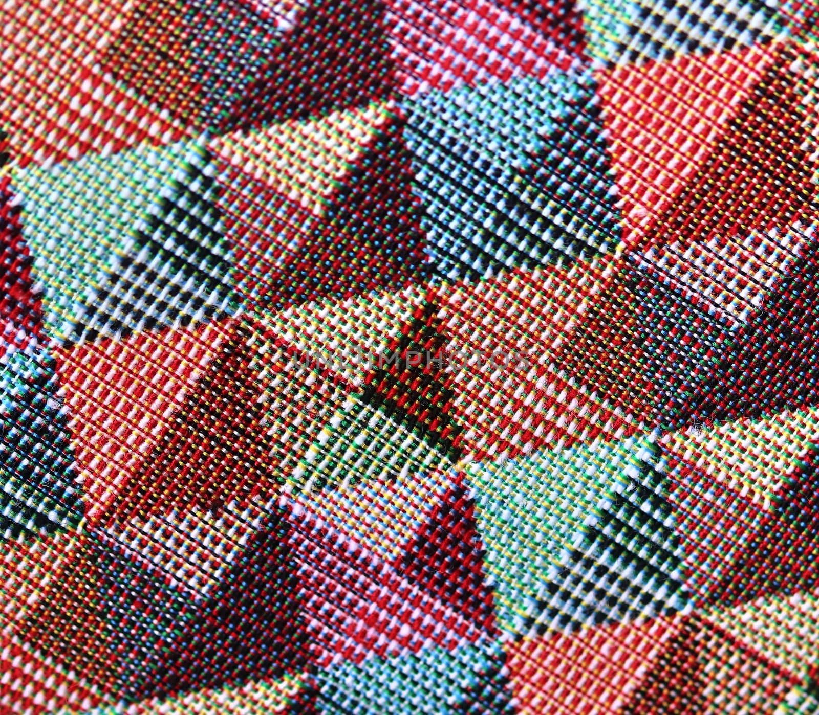 Detailed close up view on samples of cloth and fabrics in different colors found at a fabrics market.